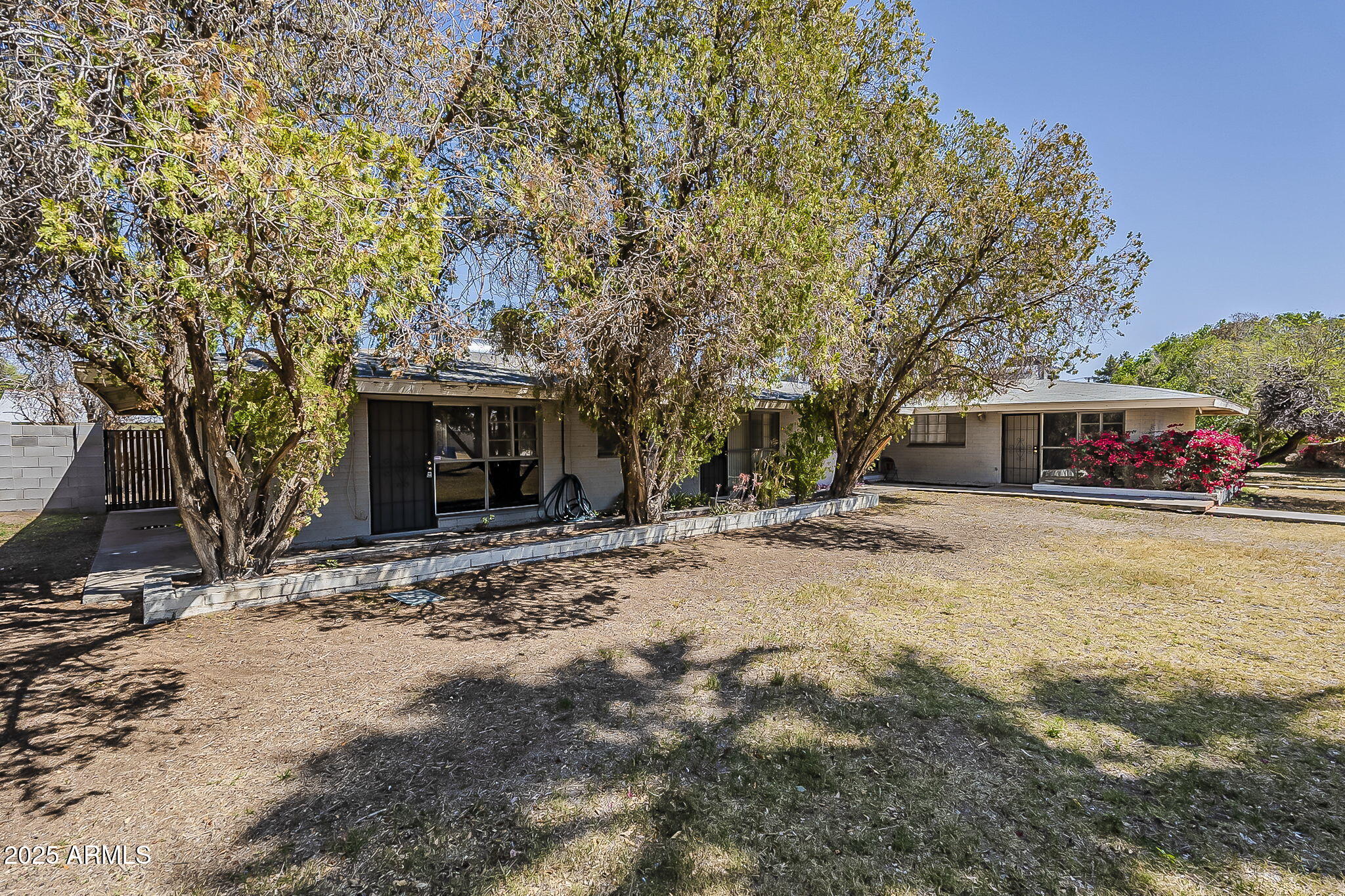 6225 North 10th Place Phoenix, AZ 85014 - Photo 9 of 32 a front view of a house with a yard and garage