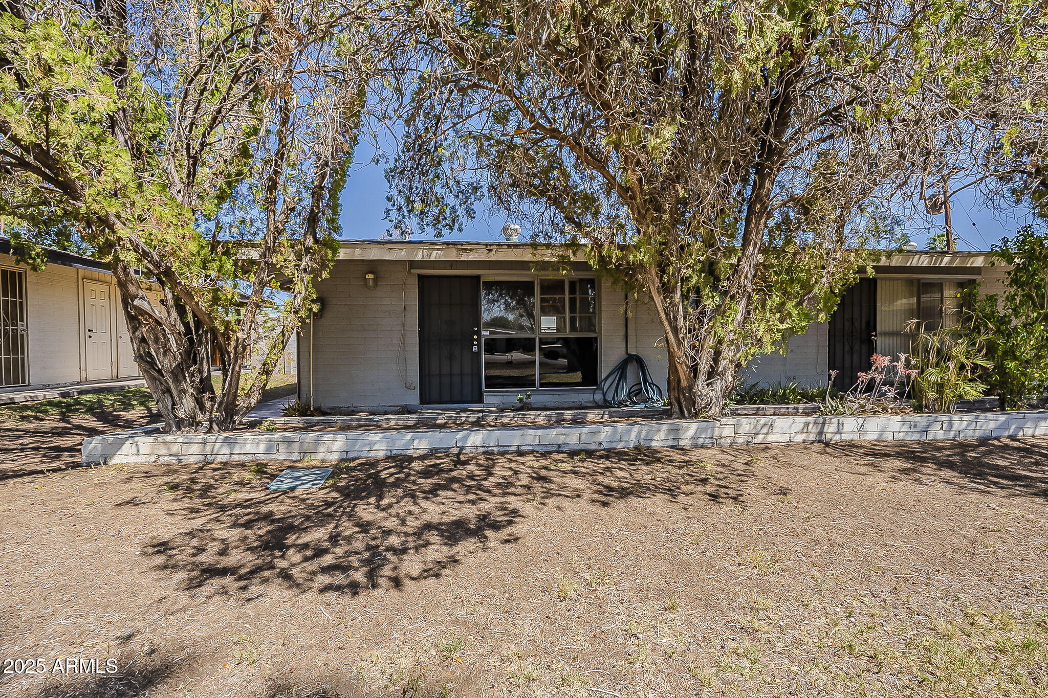 6225 North 10th Place Phoenix, AZ 85014 - Photo 10 of 32 a front view of a house with a yard