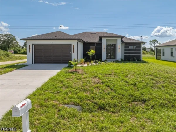$459,900 | 816 Floyd Avenue South, Lehigh Acres, FL 33976