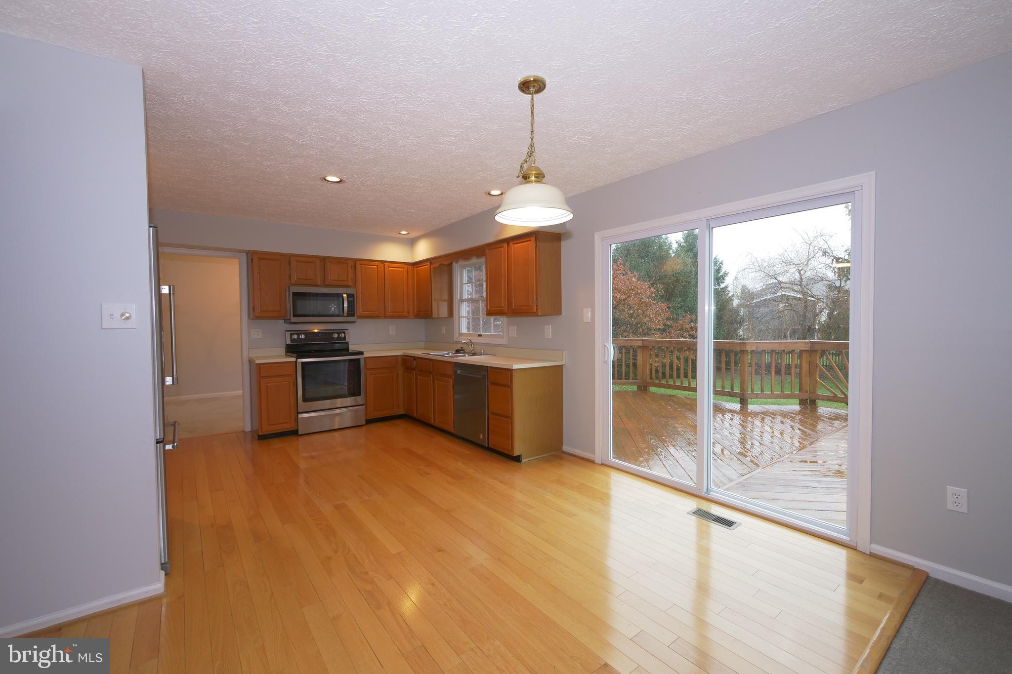 5608 Alysheba Way Frederick, MD 21703 - Photo 14 of 40 Main Level Kitchen with Dining Area