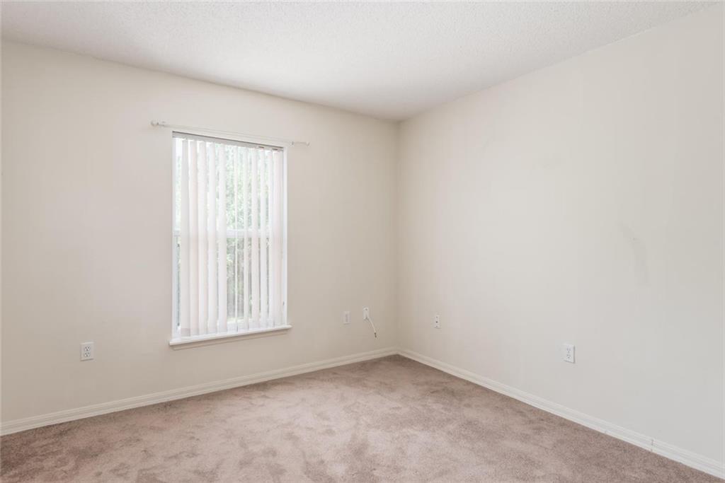 5665 Northwest Whitecap Road Port St. Lucie, FL 34986 - Photo 20 of 25 an empty room with windows