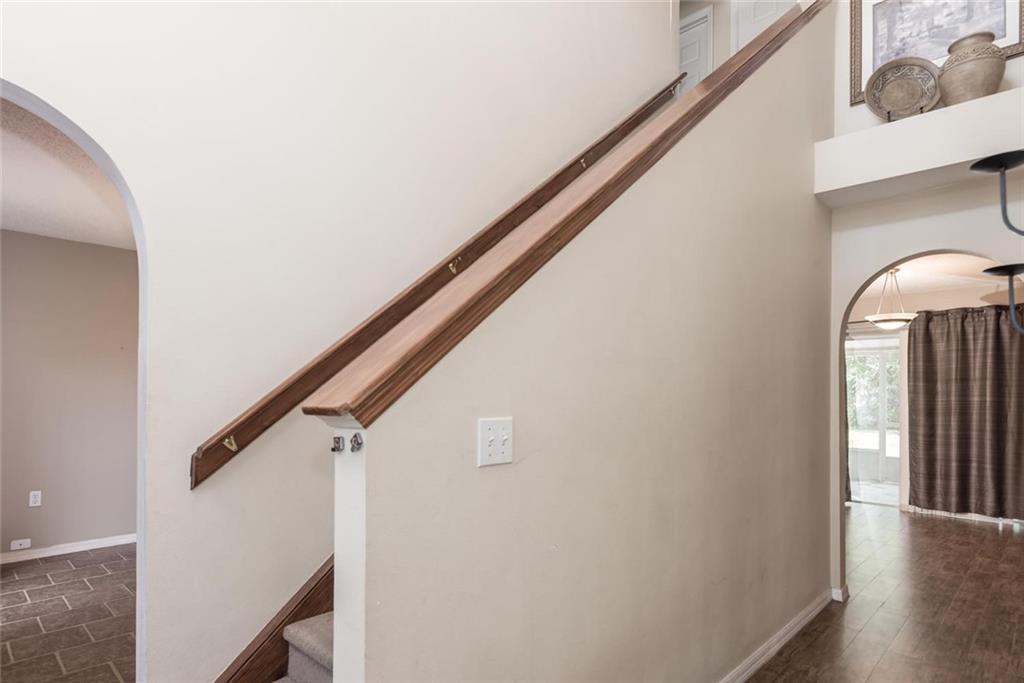 5665 Northwest Whitecap Road Port St. Lucie, FL 34986 - Photo 2 of 25 a view of entryway with stairs and wooden floor