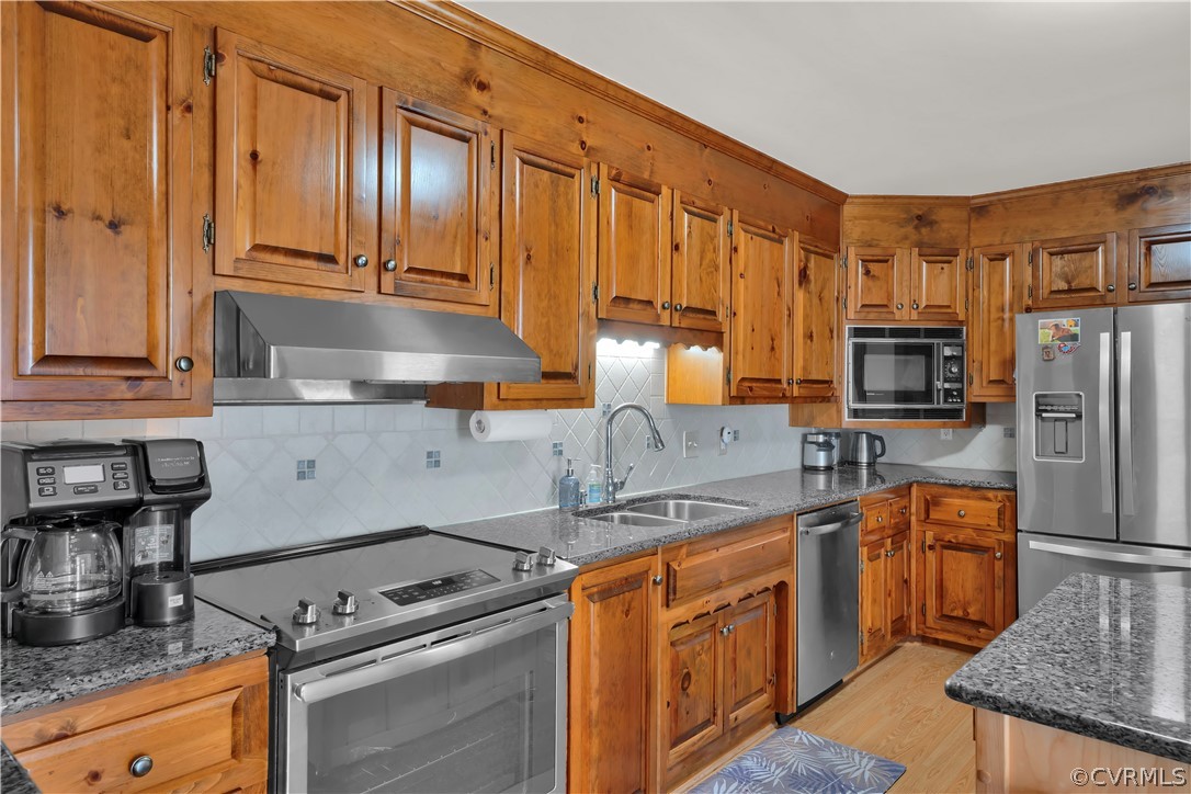 13113 Bluemont Road Chester, VA 23831 - Photo 11 of 41 a kitchen with stainless steel appliances granite countertop a stove a sink and a refrigerator