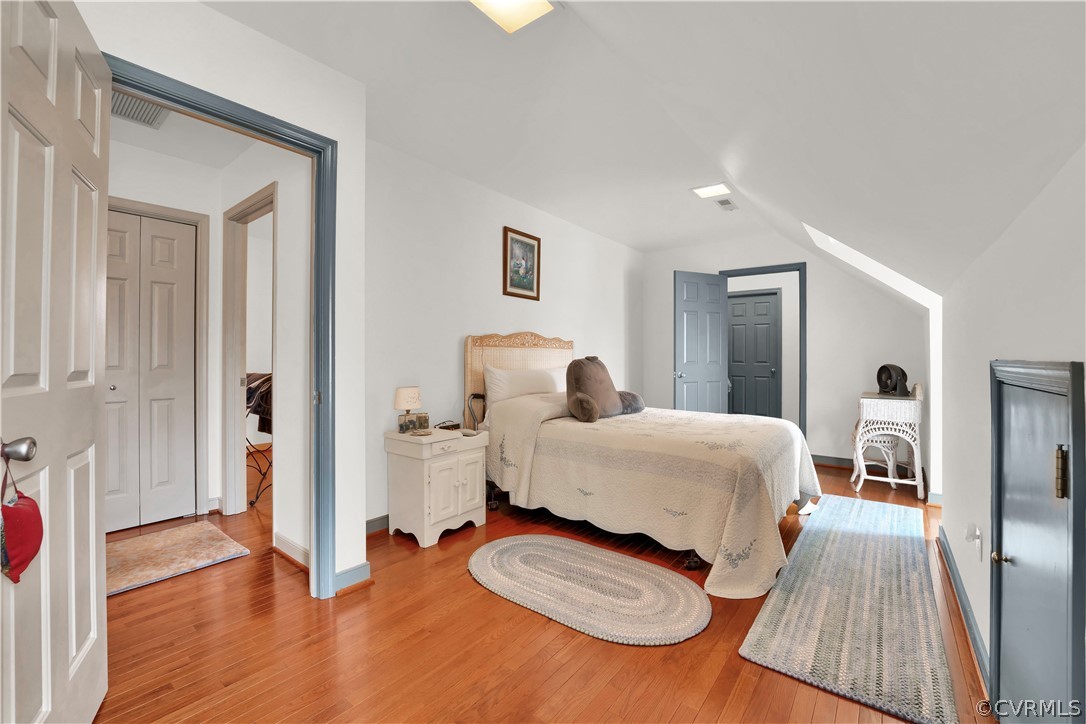 13113 Bluemont Road Chester, VA 23831 - Photo 31 of 41 a bedroom with a bed and wooden floor