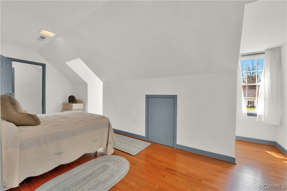 13113 Bluemont Road Chester, VA 23831 - Photo 32 of 41 a bedroom with a bed and wooden floor