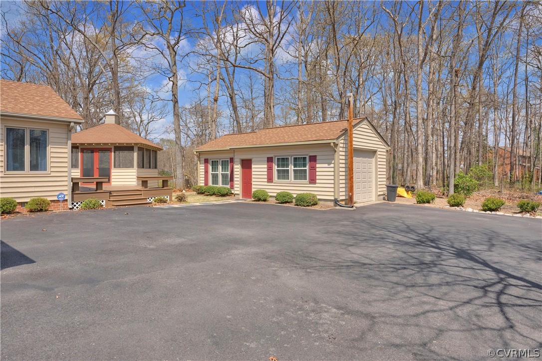 13113 Bluemont Road Chester, VA 23831 - Photo 36 of 41 a view of a house with a large space and a car parked beside