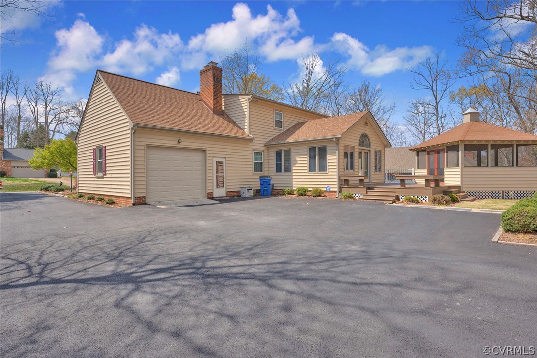 13113 Bluemont Road Chester, VA 23831 - Photo 37 of 41 a front view of a house with a yard and a garage