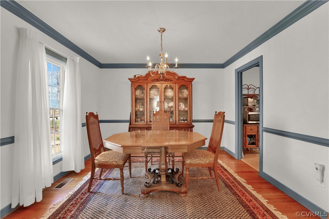 13113 Bluemont Road Chester, VA 23831 - Photo 8 of 41 a view of a dining room with furniture window and wooden floor