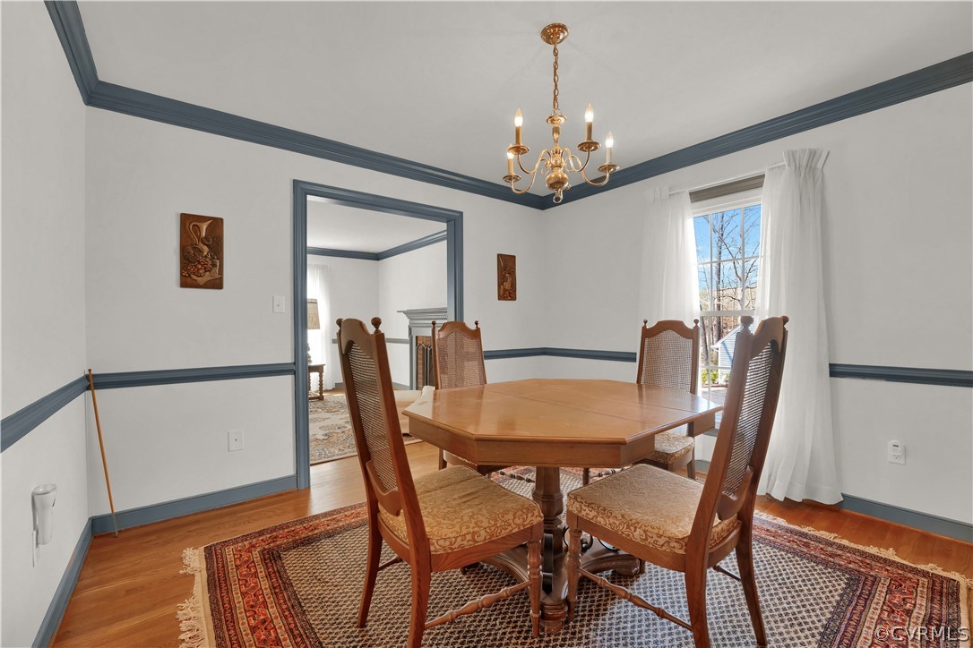 13113 Bluemont Road Chester, VA 23831 - Photo 9 of 41 a view of a dining room with furniture and chandelier