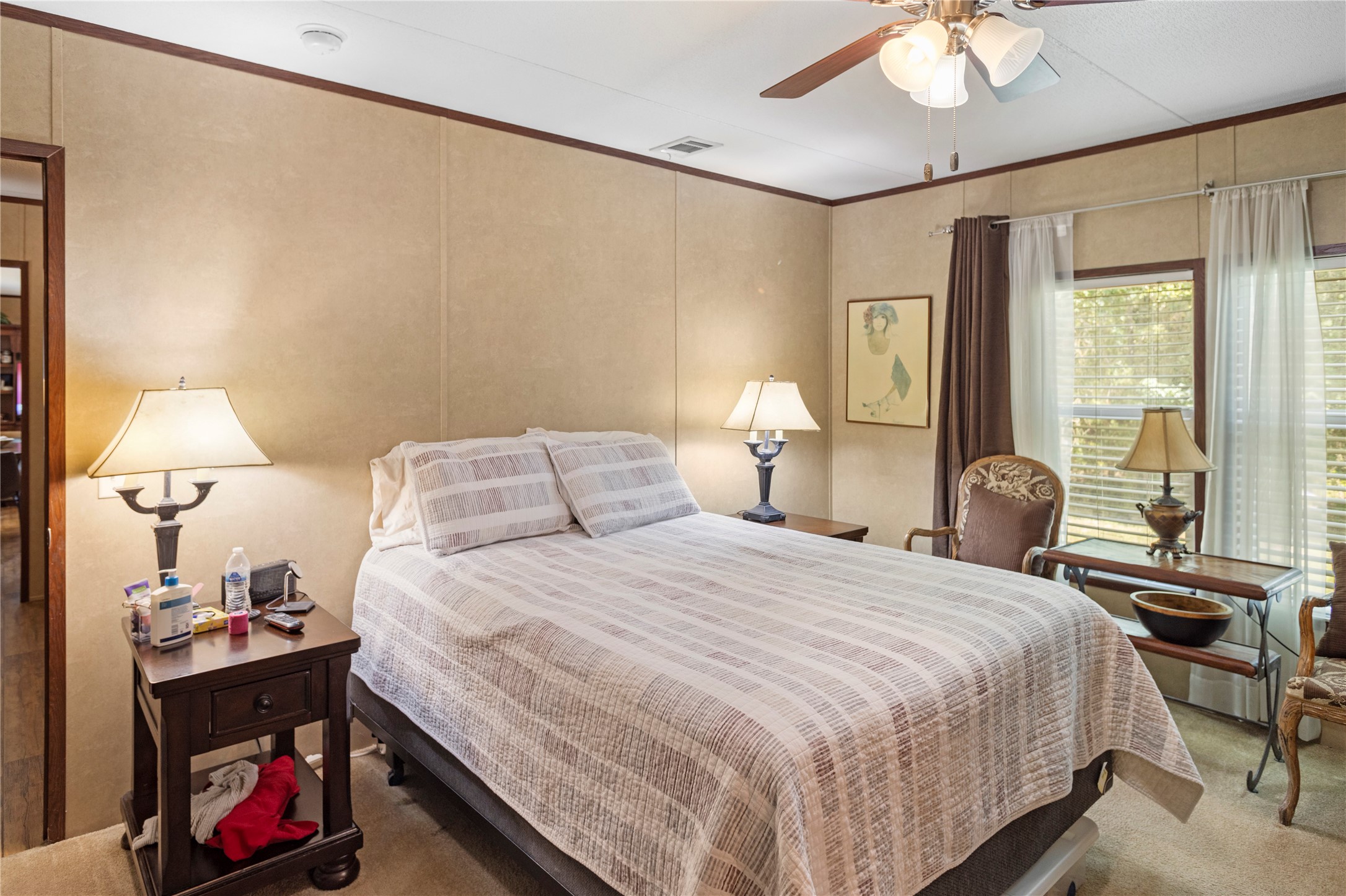 375 Chestnut Bnd Street Huntsville, TX 77320 - Photo 15 of 35 a bedroom with a bed and wooden floor