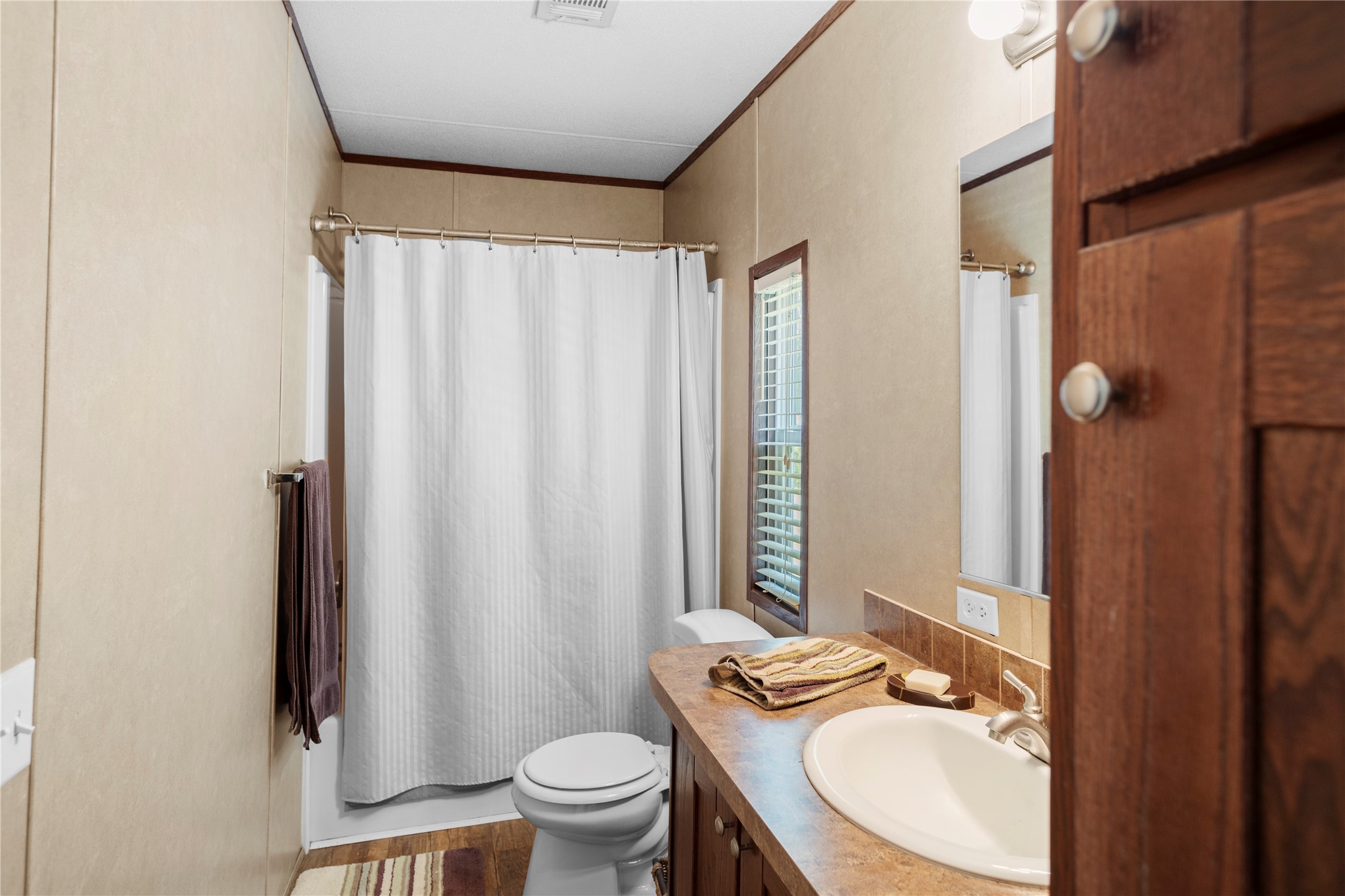 375 Chestnut Bnd Street Huntsville, TX 77320 - Photo 22 of 35 a bathroom with a granite countertop sink toilet and shower