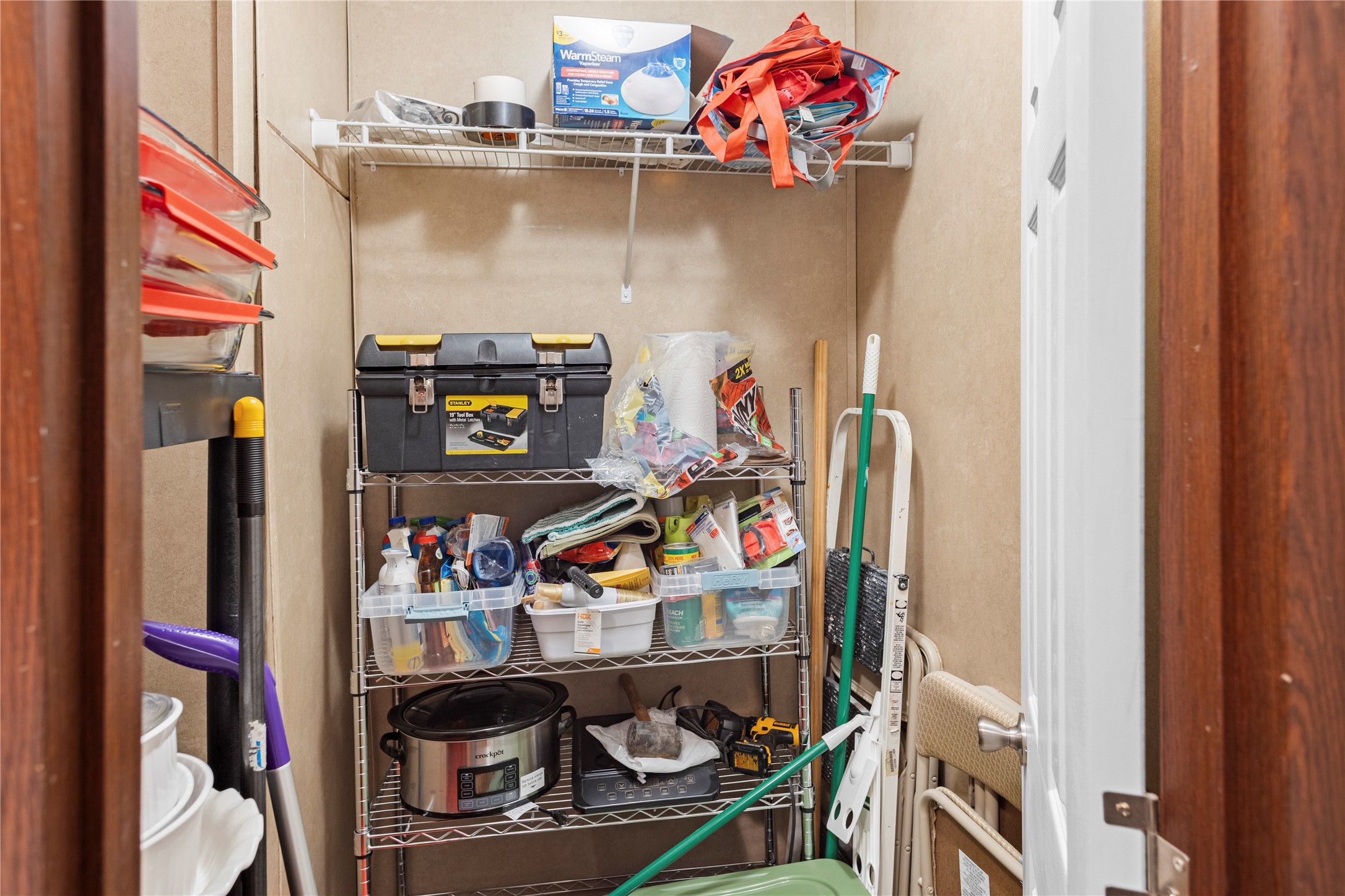 375 Chestnut Bnd Street Huntsville, TX 77320 - Photo 24 of 35 a room with storage and utility