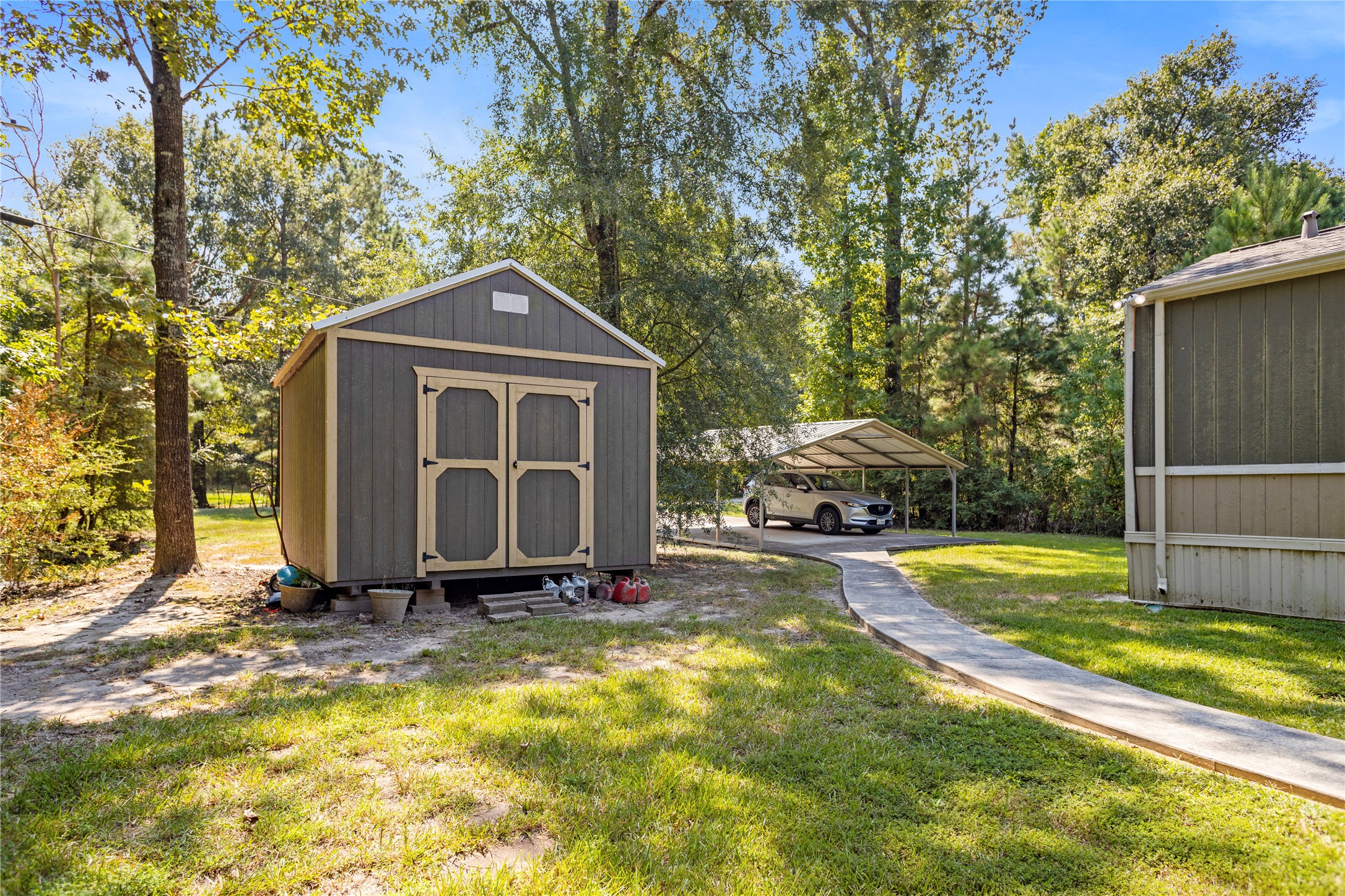 375 Chestnut Bnd Street Huntsville, TX 77320 - Photo 26 of 35 a front view of a house with a yard