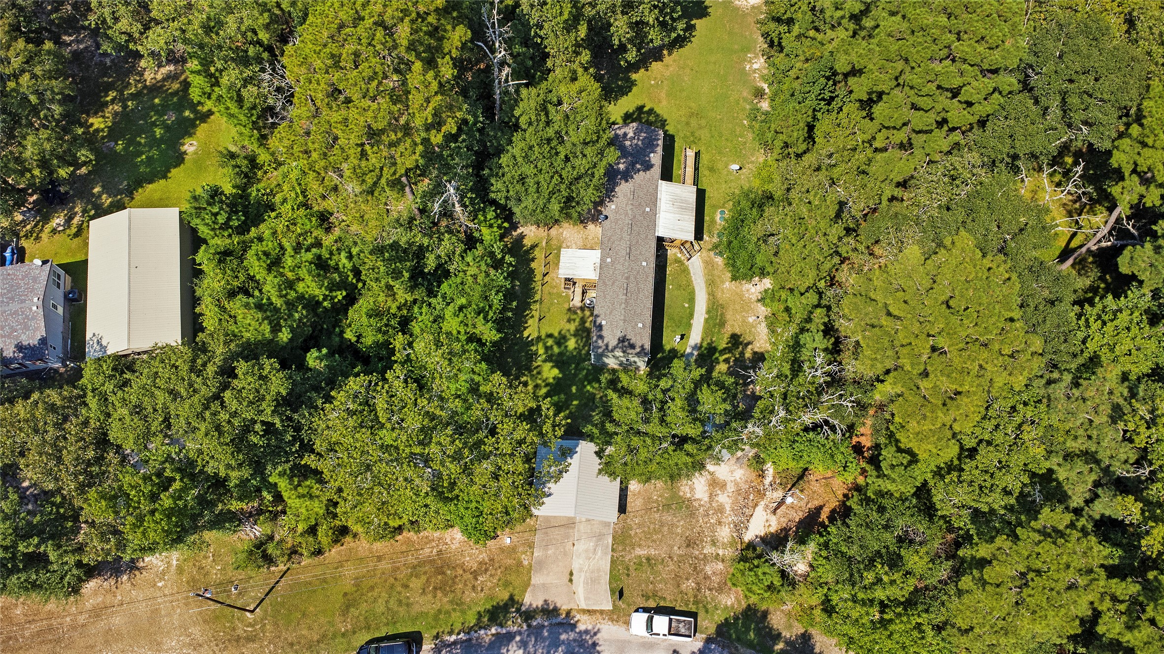 375 Chestnut Bnd Street Huntsville, TX 77320 - Photo 31 of 35 a building view with a garden space