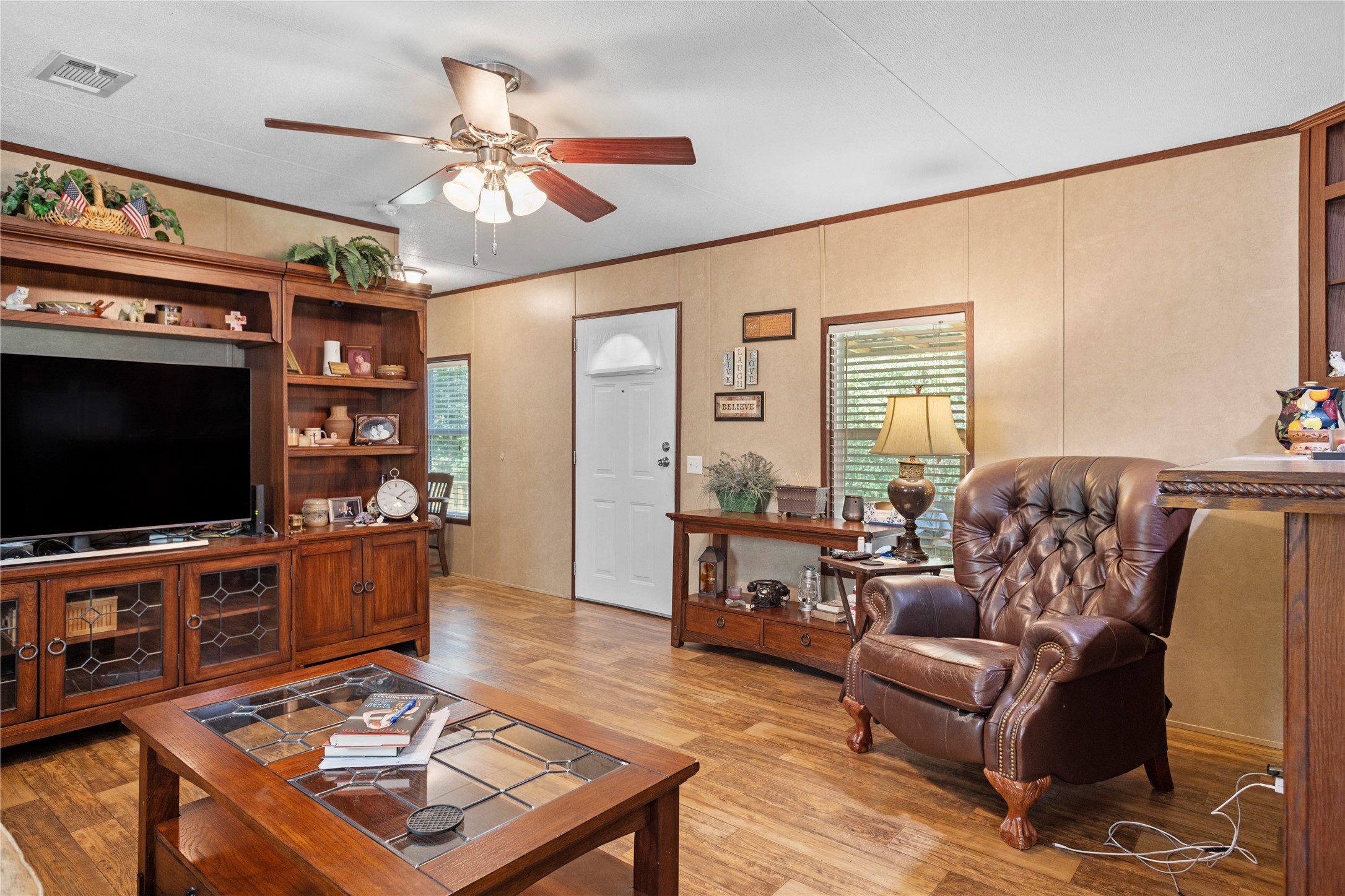 375 Chestnut Bnd Street Huntsville, TX 77320 - Photo 4 of 35 a living room with furniture and a flat screen tv