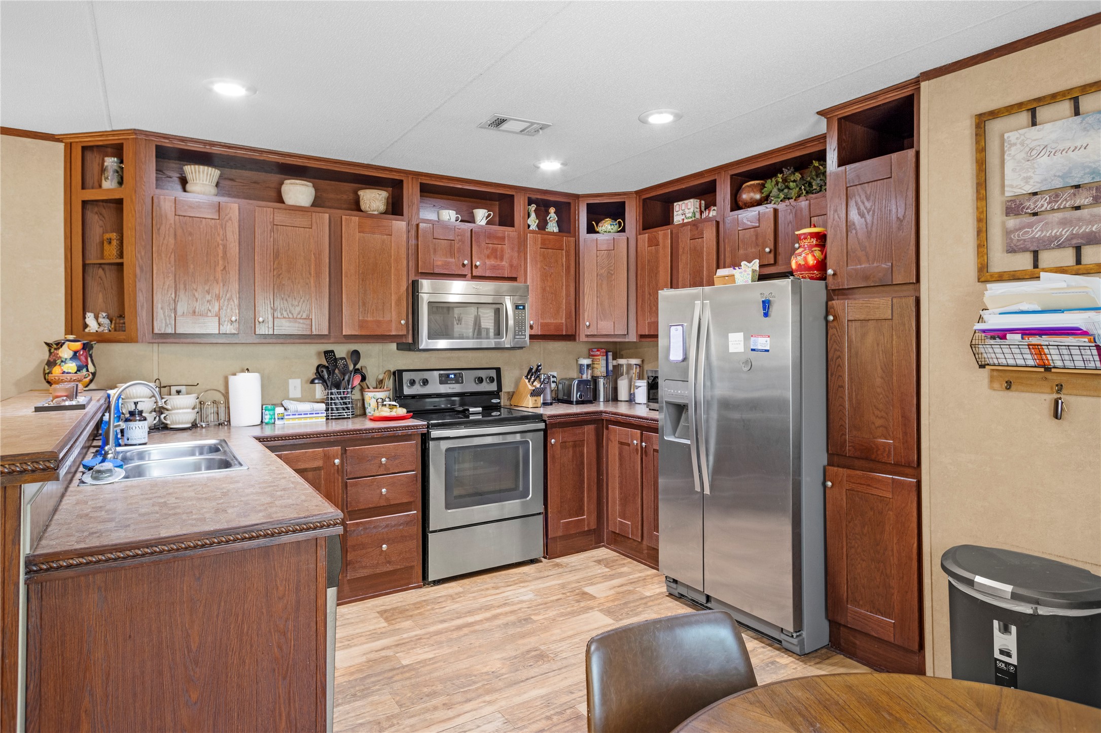 375 Chestnut Bnd Street Huntsville, TX 77320 - Photo 8 of 35 a kitchen with stainless steel appliances granite countertop a refrigerator stove top oven and sink