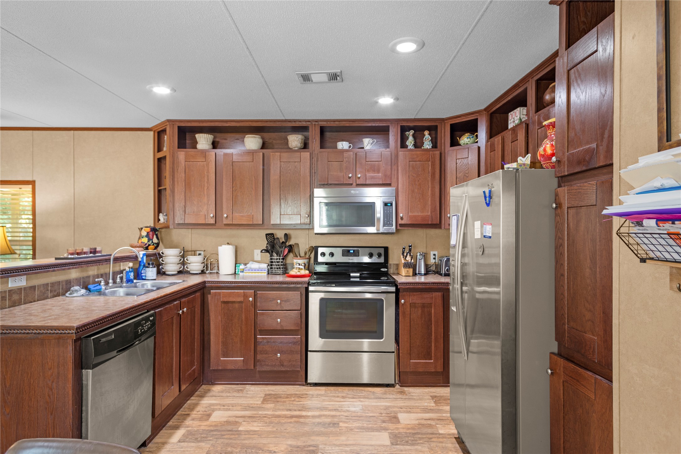 375 Chestnut Bnd Street Huntsville, TX 77320 - Photo 9 of 35 a kitchen with stainless steel appliances granite countertop a refrigerator stove and sink