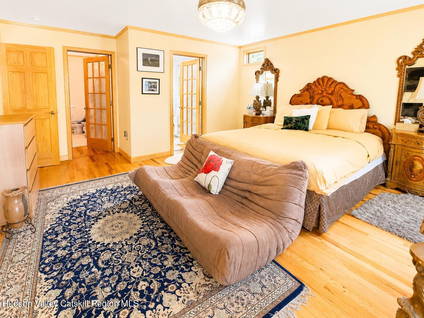 14 Park Road Chichester, NY 12416 - Photo 9 of 20 a bedroom with a bed and wooden floor