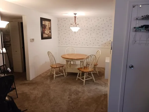 a view of a dining room with furniture