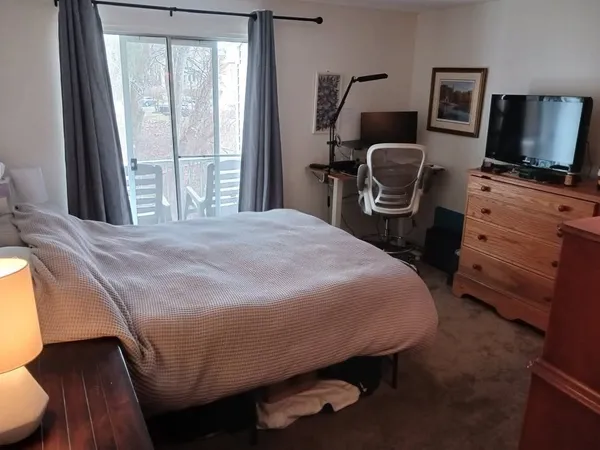 a bedroom with a bed and furniture