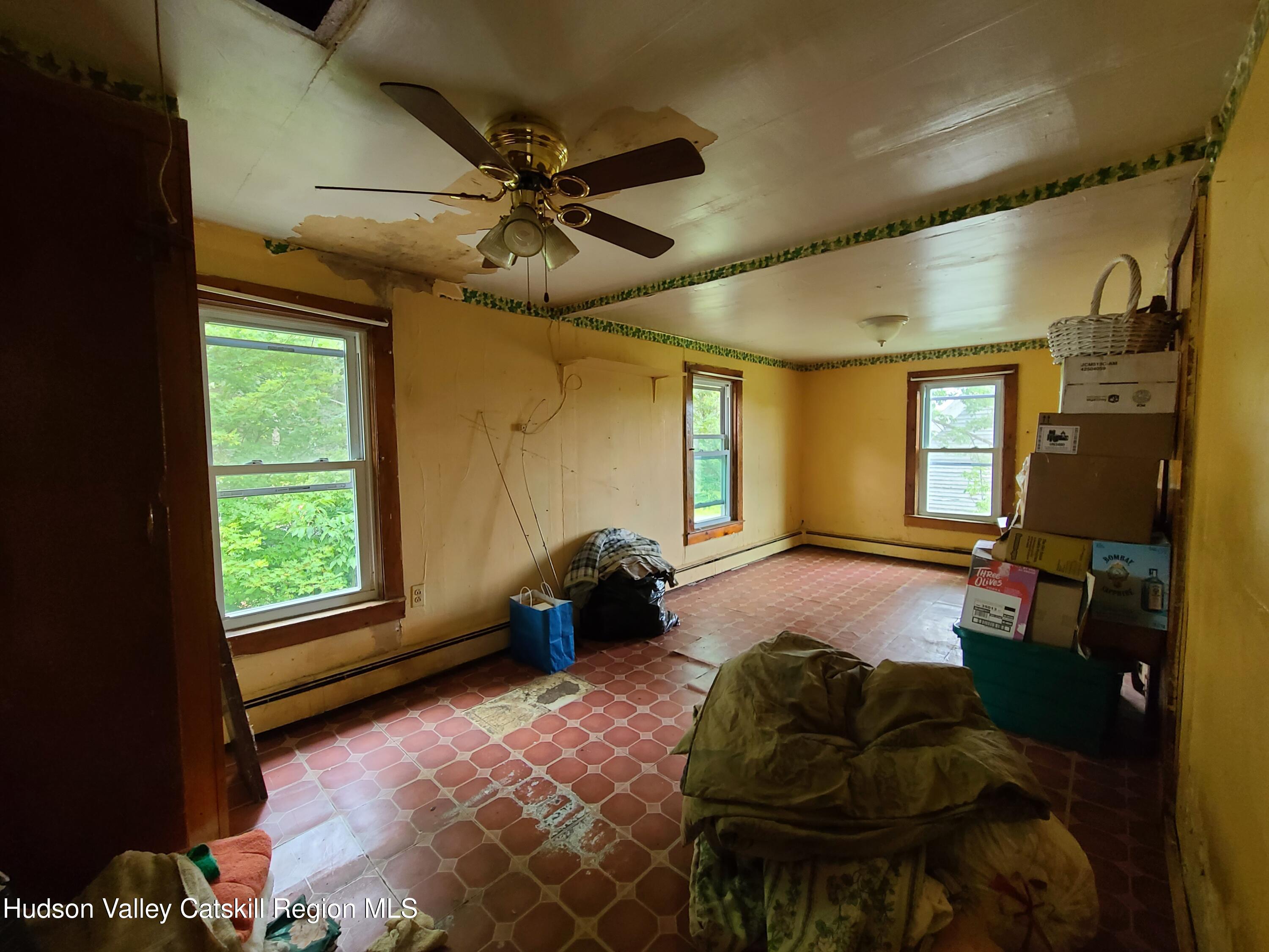 301 Stump Pond Road Livingston Manor, NY 12758 - Photo 17 of 49 a living room with furniture and a window