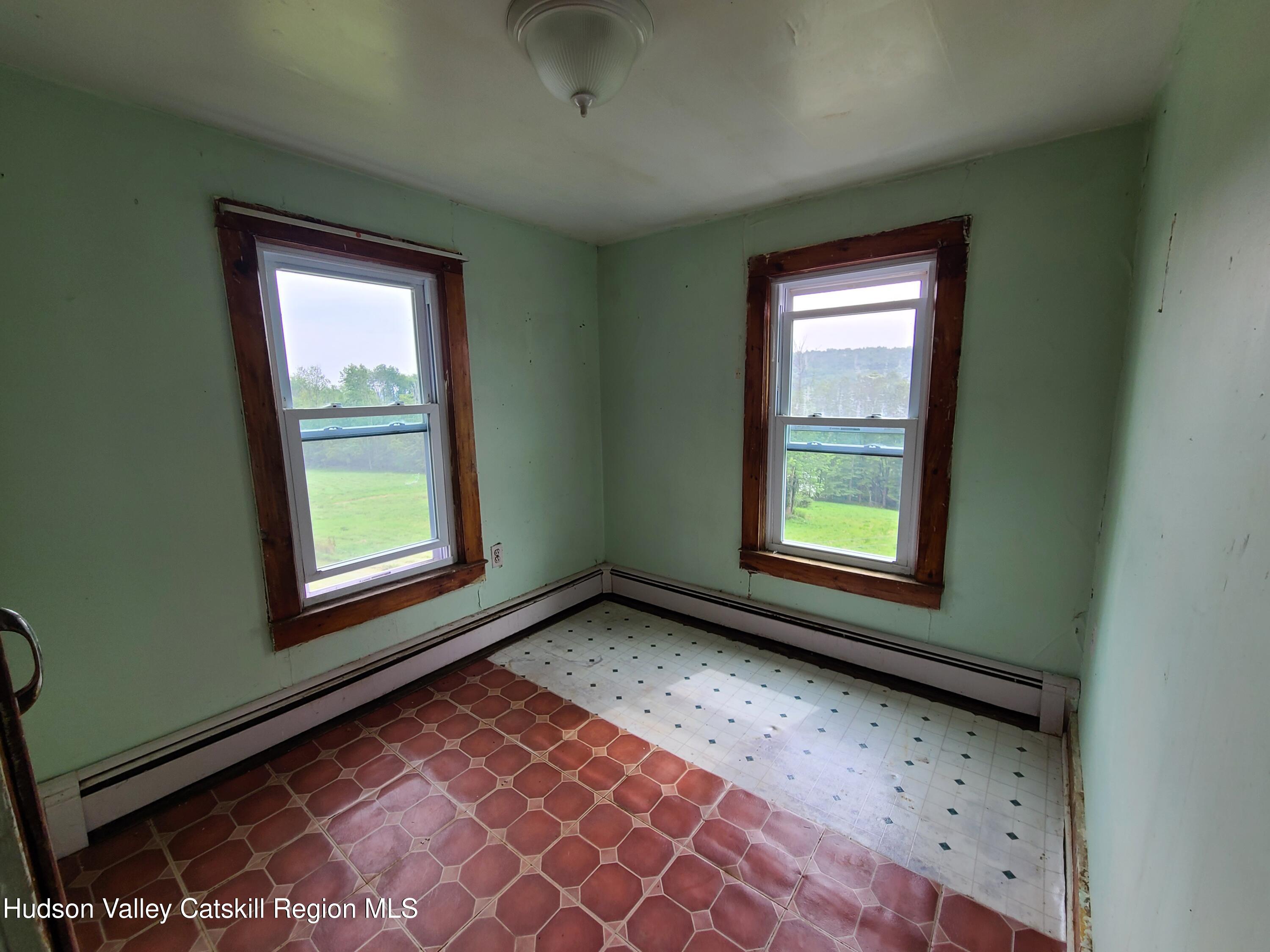 301 Stump Pond Road Livingston Manor, NY 12758 - Photo 19 of 49 a view of an empty room with a window