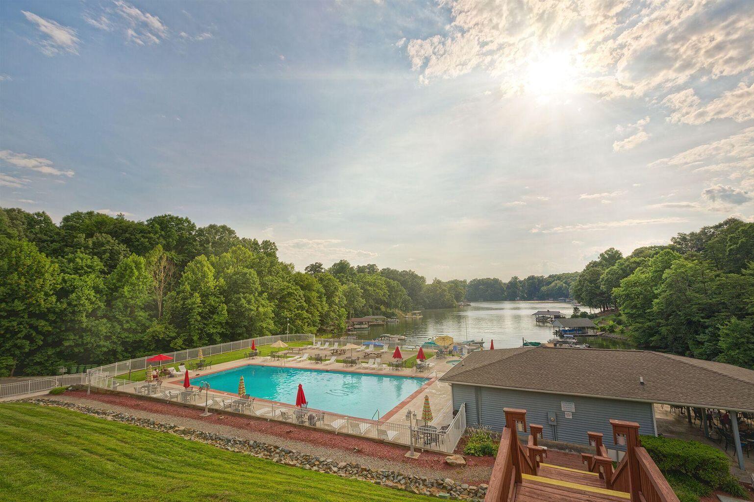 1089 Bluewater Drive, Unit 305 Moneta, VA 24121 - Photo 22 of 41 a view of a swimming pool with a patio and a yard