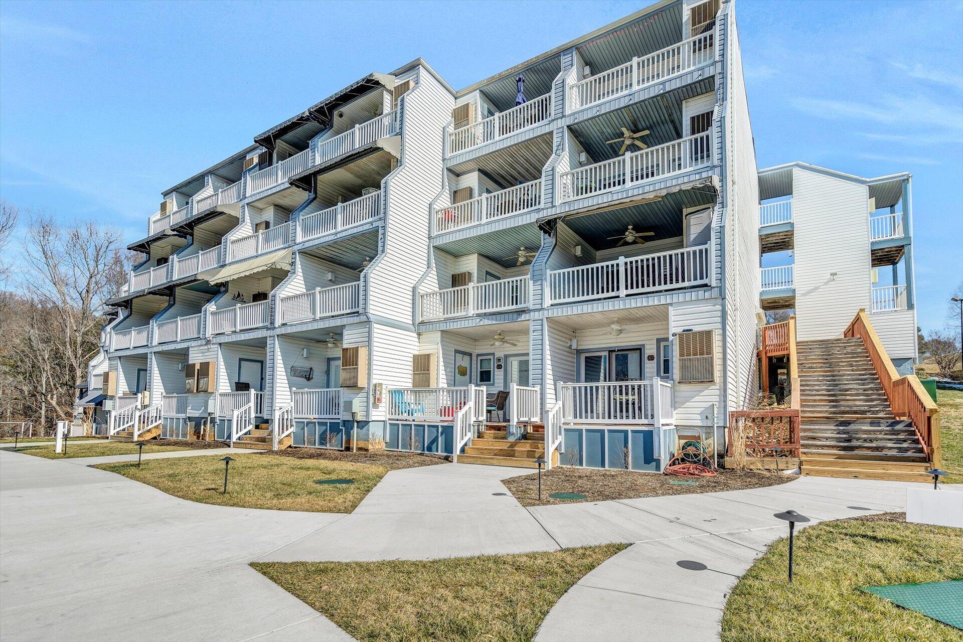 1089 Bluewater Drive, Unit 305 Moneta, VA 24121 - Photo 3 of 41 a view of building with large windows