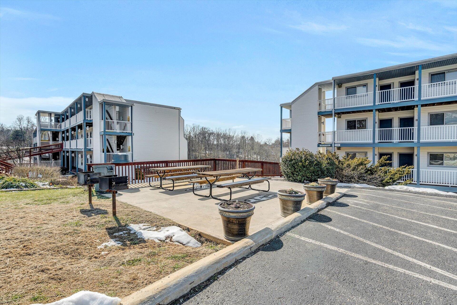 1089 Bluewater Drive, Unit 305 Moneta, VA 24121 - Photo 31 of 41 a swimming pool with outdoor seating and yard