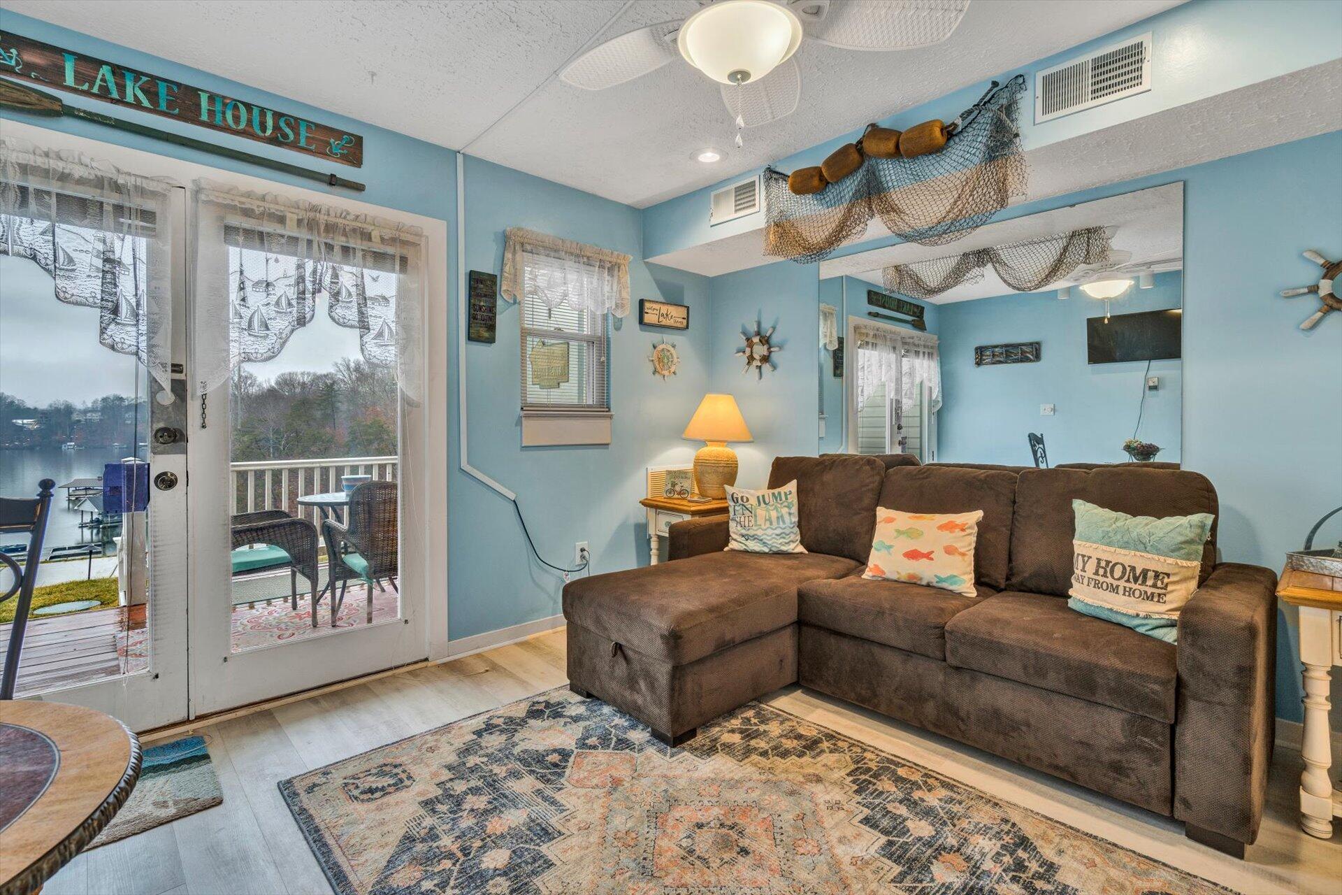 1089 Bluewater Drive, Unit 305 Moneta, VA 24121 - Photo 8 of 41 a living room with furniture and a rug
