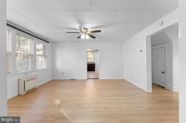 a view of an empty room with a window