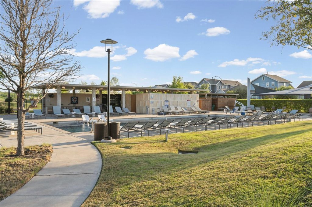 9015 Cattle Baron Path, Unit 705 Austin, TX 78747 - Photo 31 of 35 a view of a swimming pool with a patio