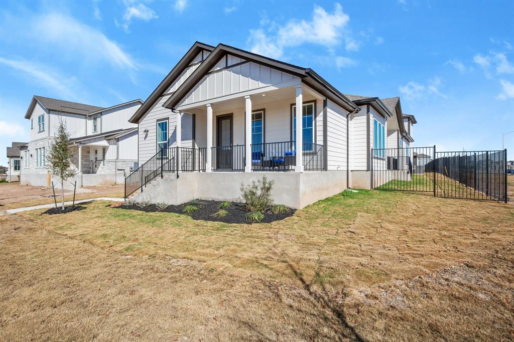 8810 Bestride Bend Austin, TX 78744 - Photo 1 of 35 a front view of a house with a yard