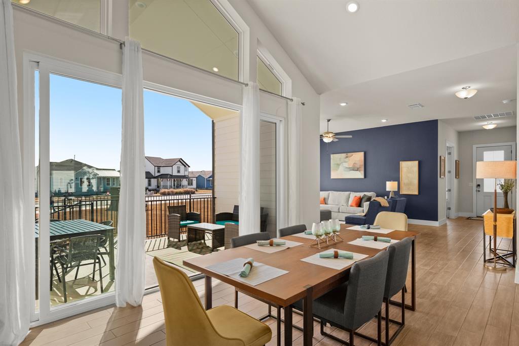 8810 Bestride Bend Austin, TX 78744 - Photo 13 of 35 a view of a dining room with furniture window and wooden floor