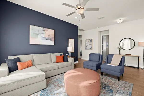 a living room with furniture and a large window