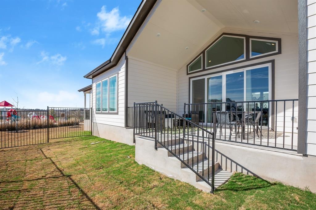 8810 Bestride Bend Austin, TX 78744 - Photo 2 of 35 a view of a house with backyard and porch