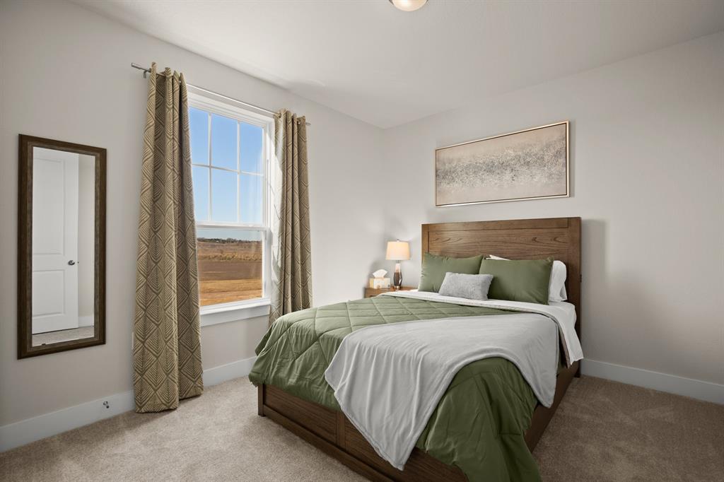 8810 Bestride Bend Austin, TX 78744 - Photo 23 of 35 a bedroom with a bed and a window