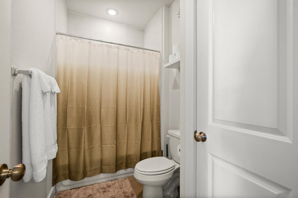 8810 Bestride Bend Austin, TX 78744 - Photo 26 of 35 a bathroom with a sink and a toilet