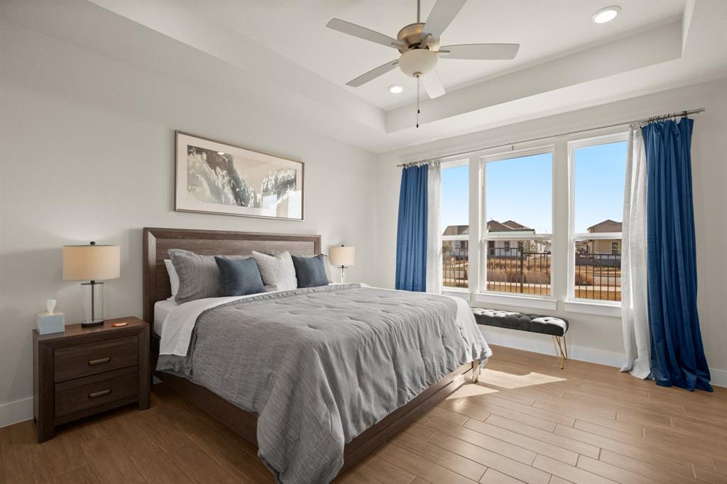 8810 Bestride Bend Austin, TX 78744 - Photo 29 of 35 a bedroom with a large bed and a large window