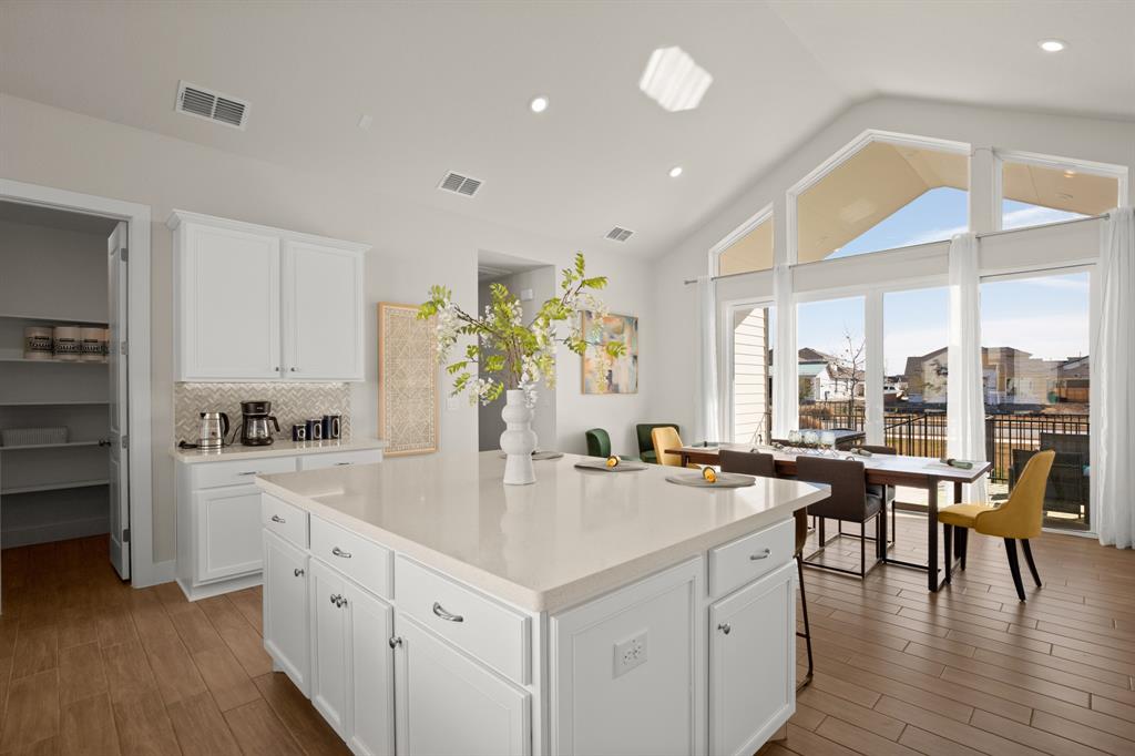8810 Bestride Bend Austin, TX 78744 - Photo 9 of 35 a kitchen with counter top space and windows