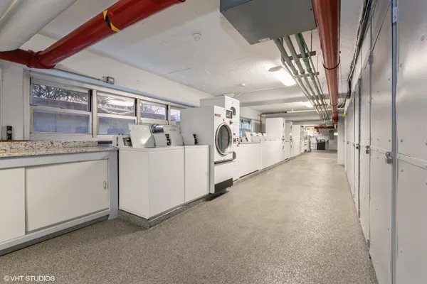 a view of a storage & utility room with a sink