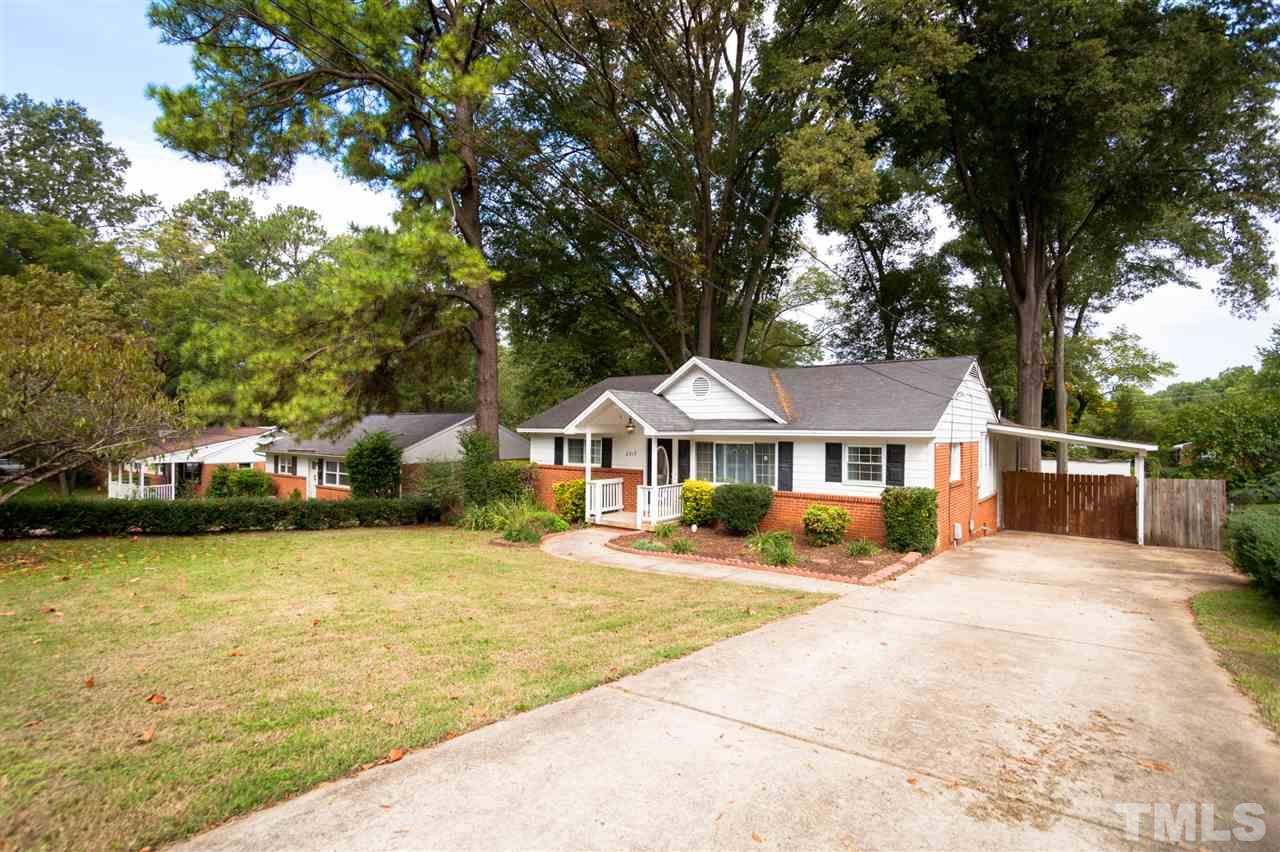 2313 Sheffield Road Raleigh, NC 27610 - Photo 2 of 25 a front view of a house with yard patio and fire pit