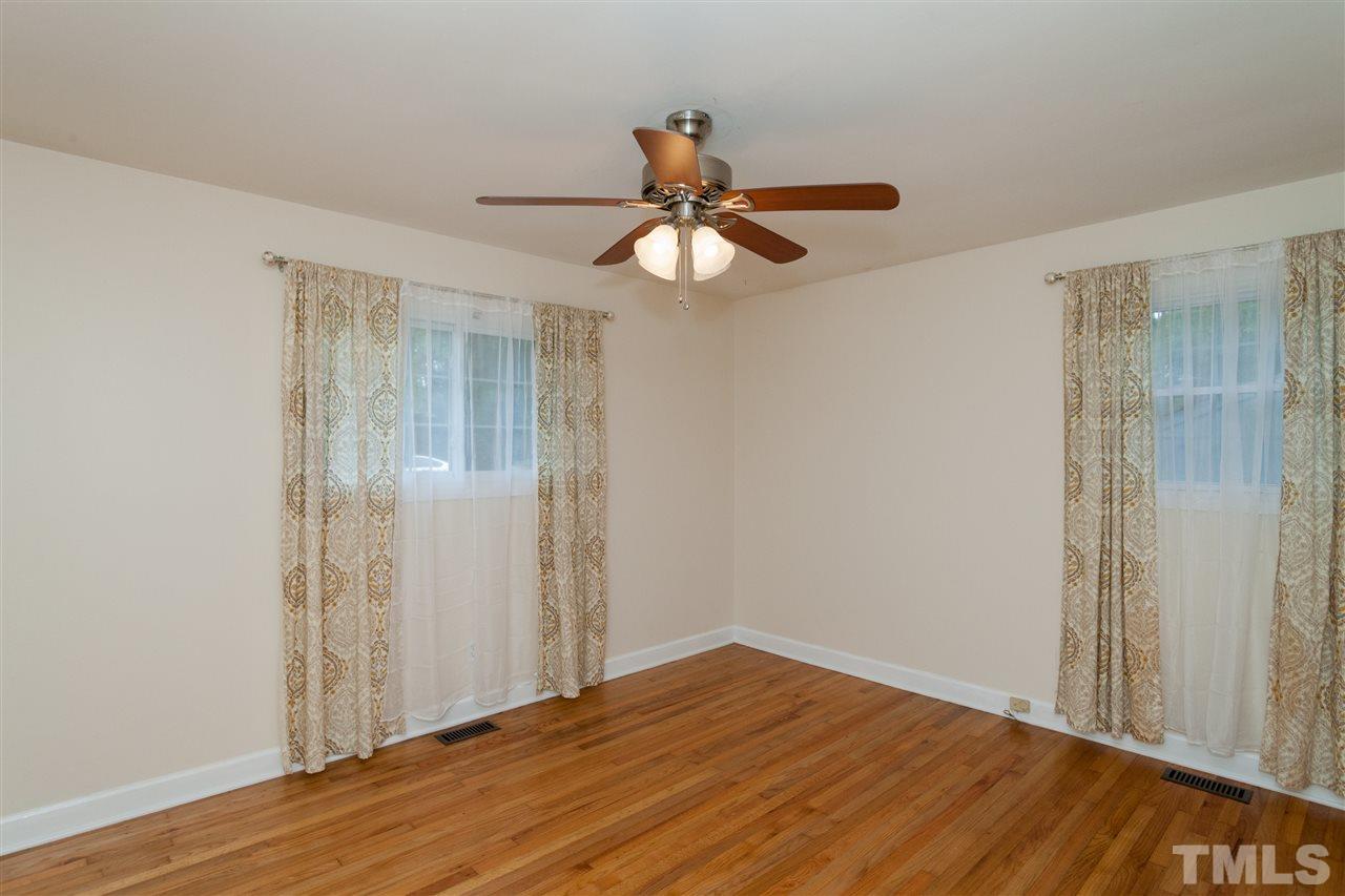 2313 Sheffield Road Raleigh, NC 27610 - Photo 15 of 25 a view of empty room with wooden floor
