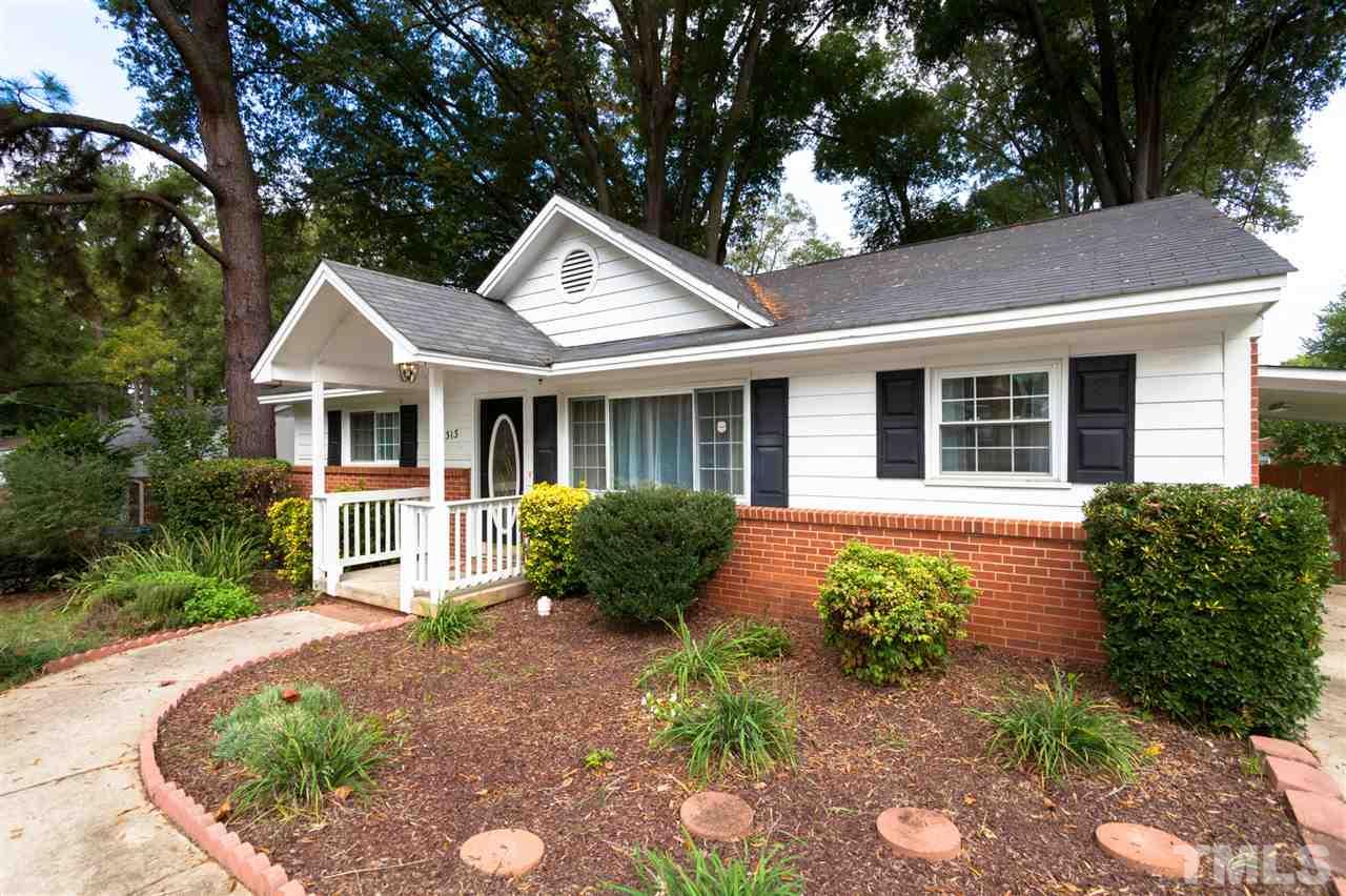 2313 Sheffield Road Raleigh, NC 27610 - Photo 3 of 25 a front view of a house with garden