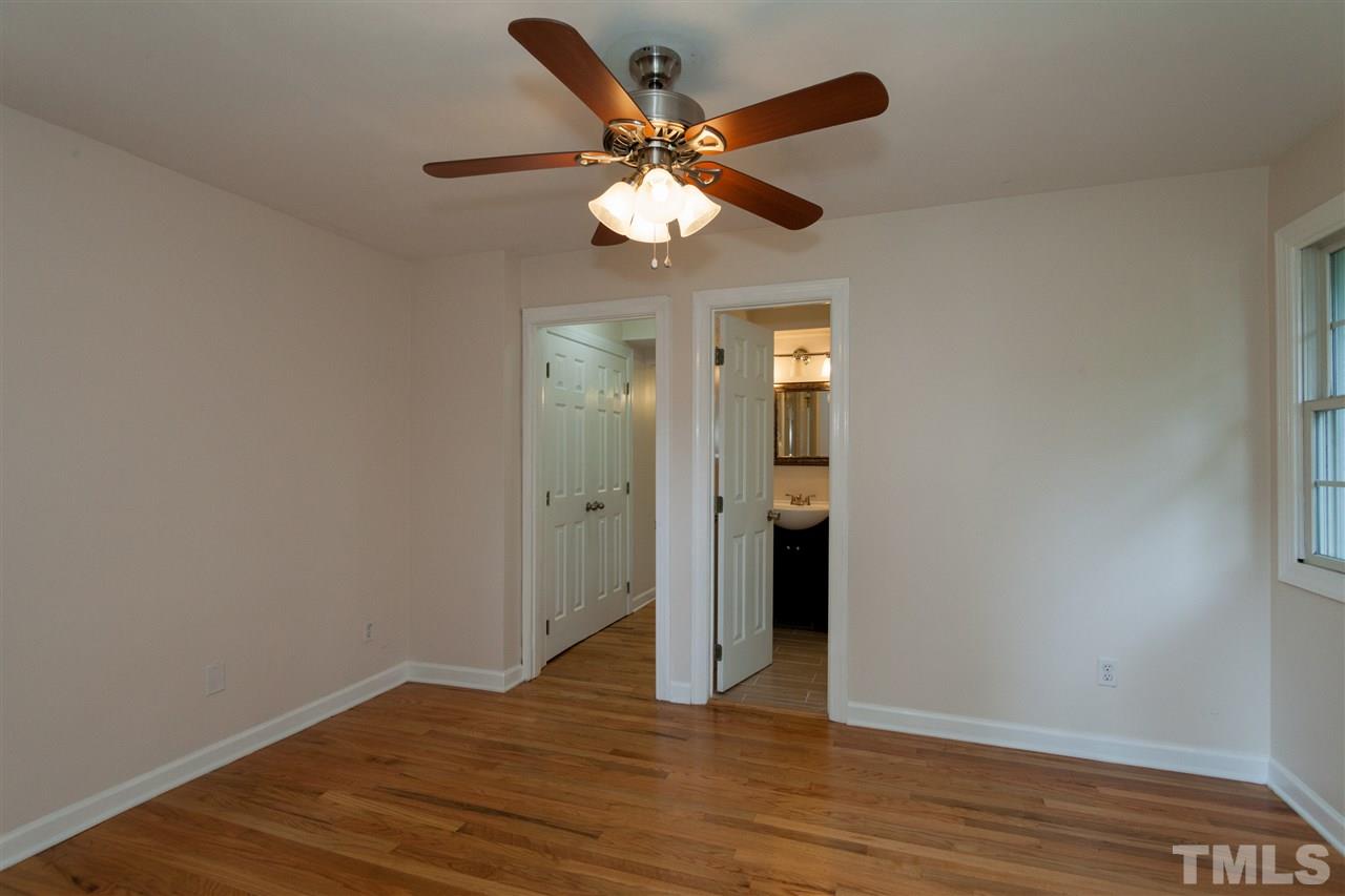 2313 Sheffield Road Raleigh, NC 27610 - Photo 22 of 25 wooden floor in an empty room with a window