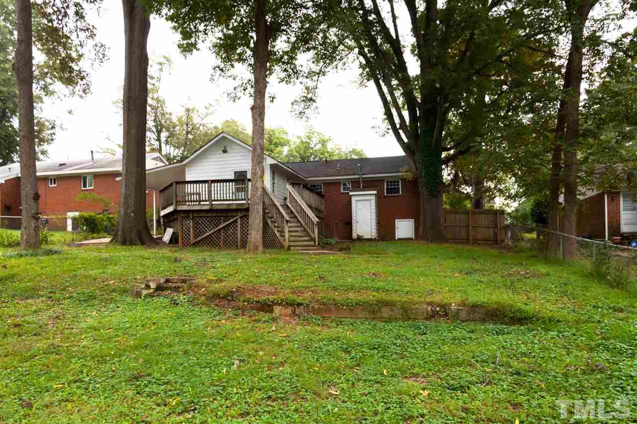 2313 Sheffield Road Raleigh, NC 27610 - Photo 25 of 25 a view of a house with backyard and a tree