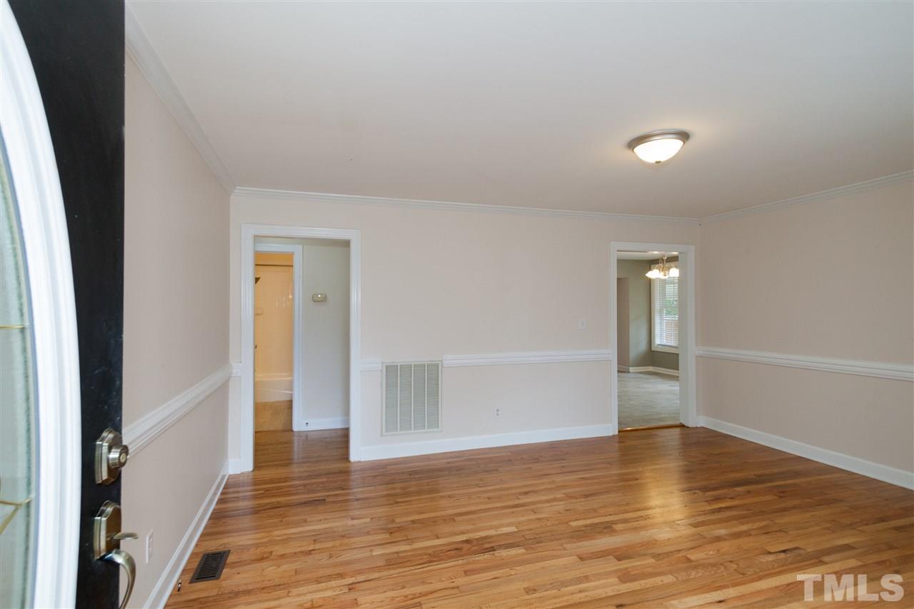 2313 Sheffield Road Raleigh, NC 27610 - Photo 5 of 25 a view of empty room with wooden floor