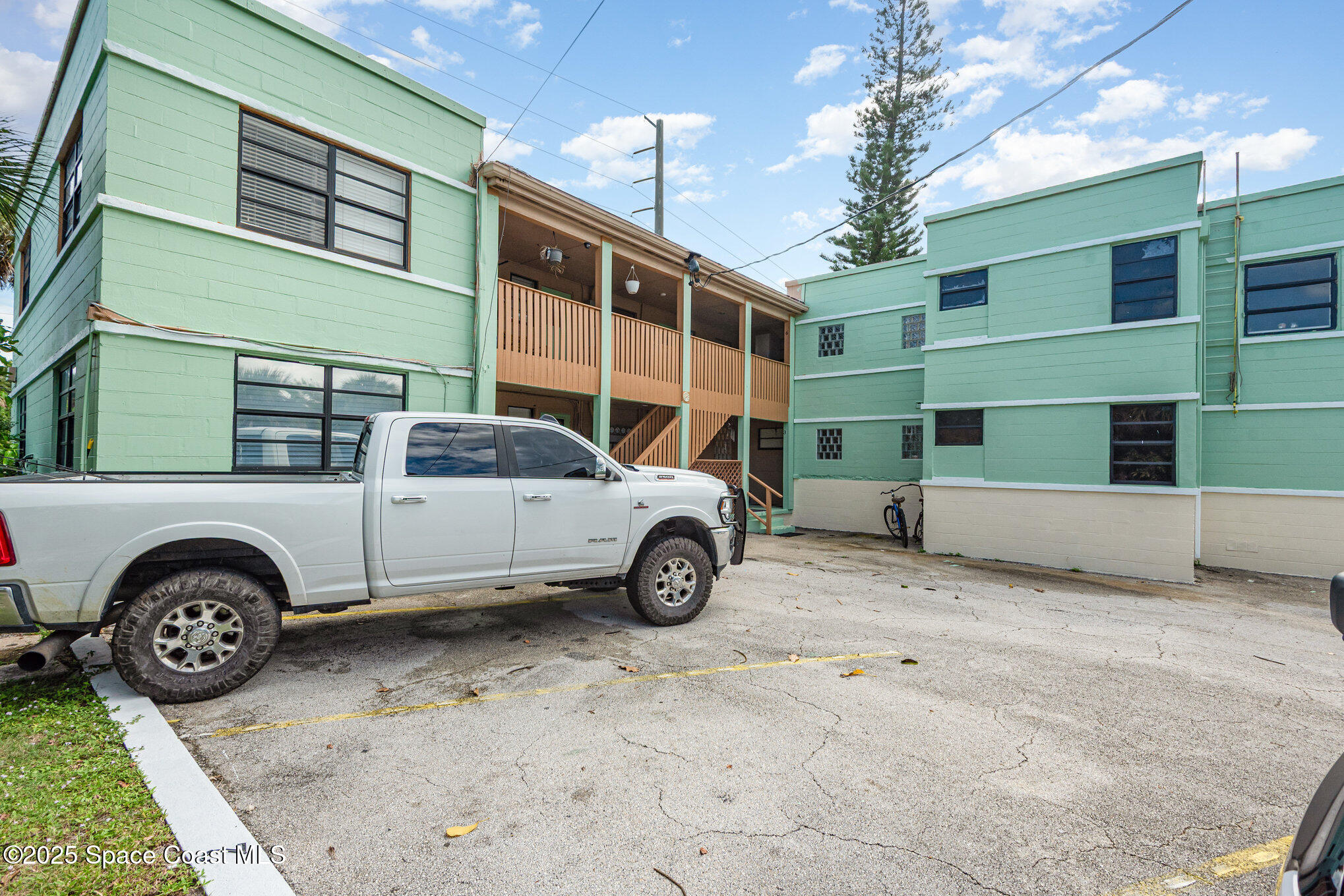 Undisclosed Address Cocoa Beach, FL 32931 - Photo 15 of 20 a car parked in front of a house