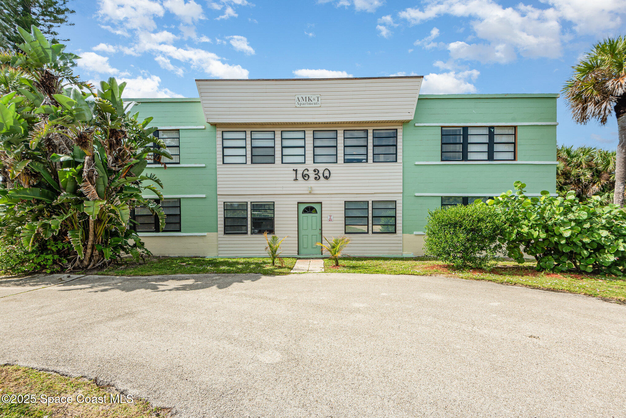 Undisclosed Address Cocoa Beach, FL 32931 - Photo 18 of 20 front view of a house with a yard
