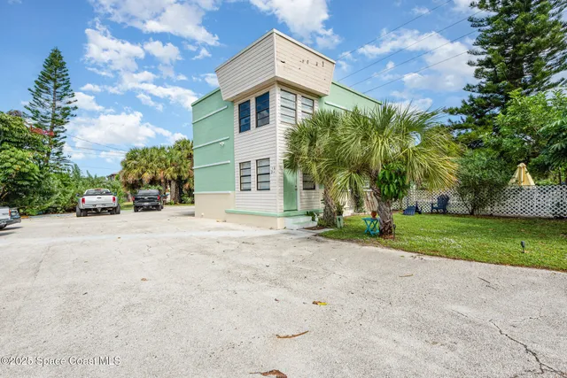 a view of a house with a yard and garage